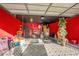 Garage with red walls and various items at 1130 Barranca Ave, Spring Hill, FL 34609
