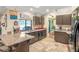 Galley kitchen with granite countertops and breakfast bar at 1130 Barranca Ave, Spring Hill, FL 34609