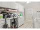 Laundry room with washer, dryer, and cabinets at 1130 Barranca Ave, Spring Hill, FL 34609