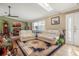 Living room featuring hardwood floors, two sofas, and a large window at 1130 Barranca Ave, Spring Hill, FL 34609