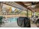 Enclosed pool area with grill and patio furniture at 1130 Barranca Ave, Spring Hill, FL 34609