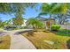 View of a single Gathering home featuring a well maintained lawn and a beautiful yard at 11652 Palmetto Pine St, Riverview, FL 33569