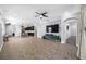 Open-concept living area with tile floors and modern ceiling fan at 11652 Palmetto Pine St, Riverview, FL 33569