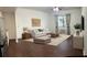 Image of living room featuring light-colored sofa and area rug at 1254 E 113Th Ave # C110, Tampa, FL 33612