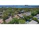 An aerial shot captures a charming neighborhood with mature trees near the waterfront and city views at 13182 72Nd Ter, Seminole, FL 33776