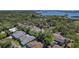 A nice neighborhood with mature trees is captured from an aerial perspective, near water and city skyline at 13182 72Nd Ter, Seminole, FL 33776