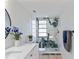 Modern bathroom with marble shower, updated vanity, and large mirror at 13182 72Nd Ter, Seminole, FL 33776