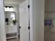 Bright bathroom with white vanity, patterned floor, and linen closet at 13182 72Nd Ter, Seminole, FL 33776