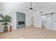 Bright bedroom with vaulted ceiling, barn door, and fireplace at 13182 72Nd Ter, Seminole, FL 33776