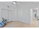 Bright bedroom with vaulted ceiling, hardwood floors, and access to hallway at 13182 72Nd Ter, Seminole, FL 33776
