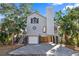Two-story house with gray siding, a large window, and a two-car garage at 13182 72Nd Ter, Seminole, FL 33776