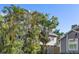Two-story house with solar panels, surrounded by palm trees at 13182 72Nd Ter, Seminole, FL 33776