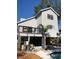 Two-story home with a deck, fenced pool, and lush landscaping at 13182 72Nd Ter, Seminole, FL 33776