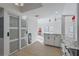 Modern kitchen with white cabinets, granite countertops, and a breakfast bar at 13182 72Nd Ter, Seminole, FL 33776