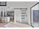 Bright and airy living room with sliding barn door and hardwood floors at 13182 72Nd Ter, Seminole, FL 33776