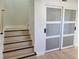Modern staircase with light wood treads and dark accents at 13182 72Nd Ter, Seminole, FL 33776
