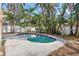 Private kidney shaped pool surrounded by tropical landscaping at 13182 72Nd Ter, Seminole, FL 33776