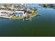 Aerial view of waterfront home with private dock and pool; desirable location at 16139 4Th E St, Redington Beach, FL 33708