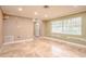 Spacious living room featuring large windows and tile floors at 1968 Rolling Green Cir, Sarasota, FL 34240