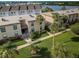 Aerial view of condo building and landscaping at 19725 Gulf Blvd # 46, Indian Shores, FL 33785