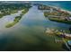 Wide aerial view of canal, waterfront, and beach at 19725 Gulf Blvd # 46, Indian Shores, FL 33785