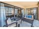 Relaxing balcony with patio furniture and view of surrounding buildings at 19725 Gulf Blvd # 46, Indian Shores, FL 33785