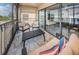 Private screened balcony with seating area at 19725 Gulf Blvd # 46, Indian Shores, FL 33785