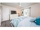 Spacious bedroom with a queen bed and access to a balcony at 19725 Gulf Blvd # 46, Indian Shores, FL 33785