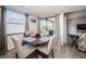 Round dining table with four chairs, situated near the kitchen at 19725 Gulf Blvd # 46, Indian Shores, FL 33785