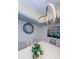 Dining room with white table, gray chairs, and modern light fixture at 19725 Gulf Blvd # 46, Indian Shores, FL 33785