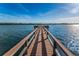 Long wooden dock providing access to the water at 19725 Gulf Blvd # 46, Indian Shores, FL 33785