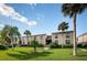 Attractive condo building with lush landscaping at 19725 Gulf Blvd # 46, Indian Shores, FL 33785