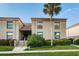 Condo building exterior with stairs and landscaping at 19725 Gulf Blvd # 46, Indian Shores, FL 33785