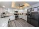 Updated kitchen featuring white cabinets and stainless steel appliances at 19725 Gulf Blvd # 46, Indian Shores, FL 33785