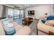 Living room with access to a balcony and plenty of natural light at 19725 Gulf Blvd # 46, Indian Shores, FL 33785