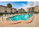Inviting community pool with surrounding patio at 19725 Gulf Blvd # 46, Indian Shores, FL 33785