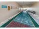 Outdoor shuffleboard court with rules posted at 19725 Gulf Blvd # 46, Indian Shores, FL 33785