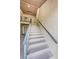 Clean indoor staircase with metal railings leading upstairs at 19725 Gulf Blvd # 46, Indian Shores, FL 33785