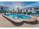 Relaxing rectangular swimming pool with lounge chairs at 19725 Gulf Blvd # 46, Indian Shores, FL 33785