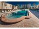 Community pool with plenty of lounge chairs at 19725 Gulf Blvd # 46, Indian Shores, FL 33785