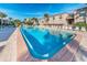 Relaxing kidney-shaped swimming pool with lounge chairs at 19725 Gulf Blvd # 46, Indian Shores, FL 33785