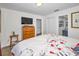 Spacious main bedroom with king-size bed and en-suite bathroom at 200 Glennes Ln # 206, Dunedin, FL 34698