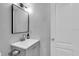 Bright bathroom featuring a modern vanity, neutral color palette, and updated mirror and lighting fixtures at 209 Red Cedar Pl # 209, Brandon, FL 33510