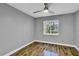 Comfortable bedroom with wood floor, ceiling fan and natural light at 209 Red Cedar Pl # 209, Brandon, FL 33510