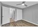 Bedroom with wood floors, walk-in closet, and neutral walls at 209 Red Cedar Pl # 209, Brandon, FL 33510