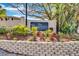 Charming entrance to The Hamptons condominium complex with lush landscaping and a welcoming sign at 209 Red Cedar Pl # 209, Brandon, FL 33510