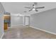 Open living room featuring tile floors, ceiling fan, and view into kitchen at 209 Red Cedar Pl # 209, Brandon, FL 33510