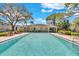Community pool with clear blue water and plenty of seating at 209 Red Cedar Pl # 209, Brandon, FL 33510