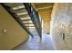 Stairway leading to upper units with tan stucco and walkway area at 209 Red Cedar Pl # 209, Brandon, FL 33510