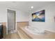 Relaxing bathroom with large jacuzzi tub and updated fixtures at 2900 Gulf Blvd # 212, Belleair Beach, FL 33786